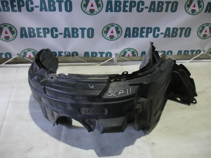 Подкрылок левый Toyota Vitz SCP10